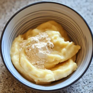 Adding protein powder to banana mixture for high protein banana bread cookies