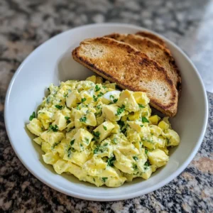 Serving high protein healthy egg salad on whole grain bread
