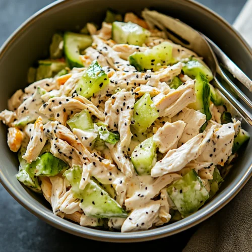 High Protein Chicken Salad Recipe served in a bowl with creamy Greek yogurt dressing, chicken, celery, and red onion